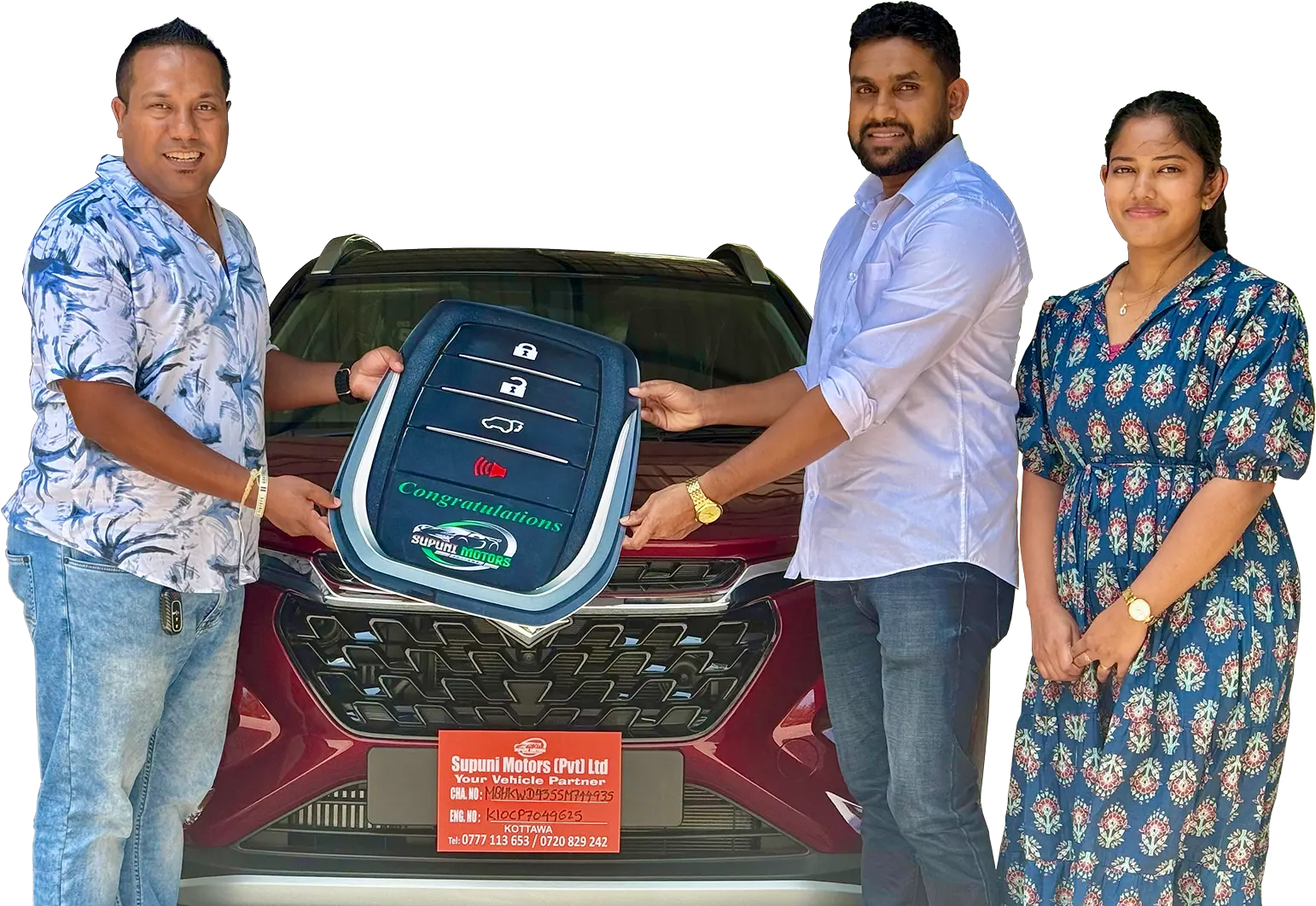 Supuni Motors team handing over a vehicle key to a happy customer
